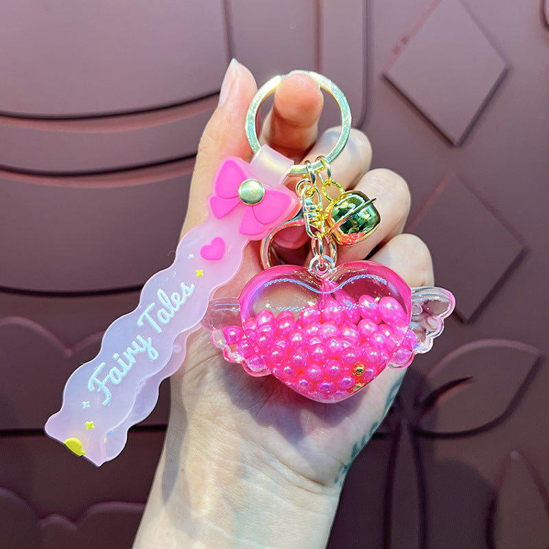 Wholesale Oil-infused Golden Bean Wing Heart Keychain